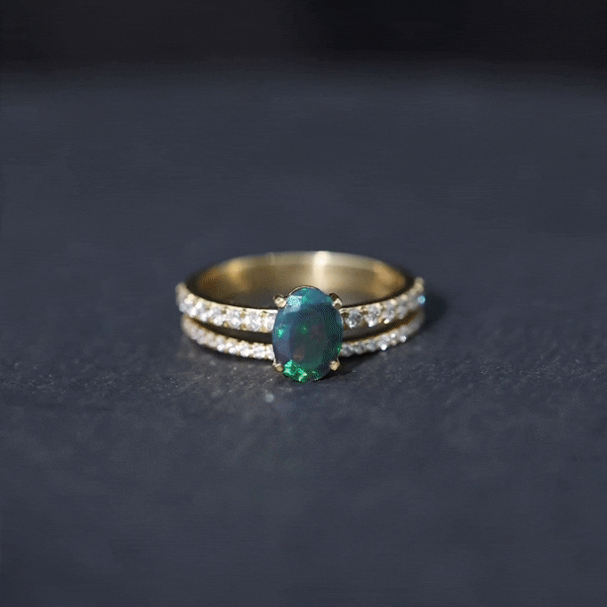 Yellow gold 0.9 carat oval cut black opal wedding ring set with diamonds from Rosec Jewels, showcasing the elegant rings.