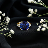 Certified 9 Carat Lab Grown Blue Sapphire Cushion Cut Engagement Ring with Diamond Trio