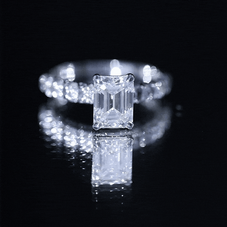 Rosec Jewels 6x8mm emerald cut lab-grown diamond engagement ring with accent stones, showcasing a yellow gold band and intricate details.