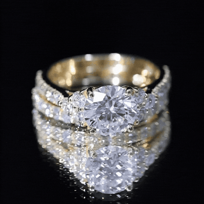 Yellow lab grown diamond engagement ring with ring guard, featuring a sparkling diamond centerpiece and intricate band design.
