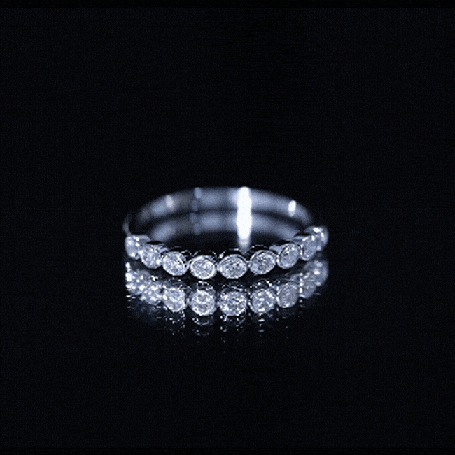 Yellow gold bezel set lab grown diamond half eternity ring by Rosec Jewels, featuring sparkling diamonds around the band.