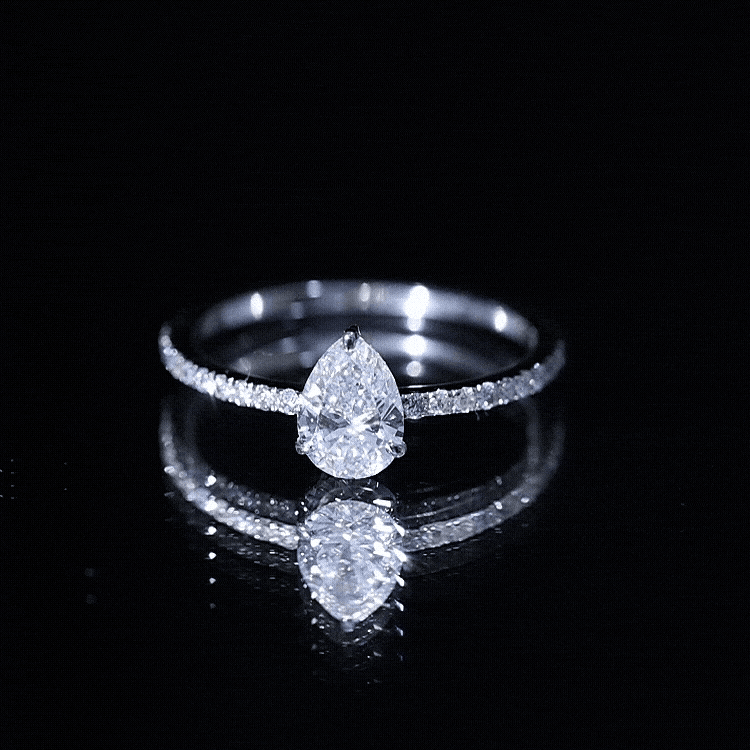 Pear-shaped 0.6 carat man-made diamond engagement ring by Rosec Jewels featuring a yellow band and elegant design.
