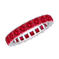 Princess cut lab-grown ruby eternity wedding band for women by Rosec Jewels, featuring a continuous row of sparkling rubies in a sleek ring.