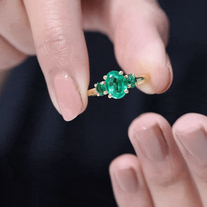 Rosec Jewels AAAA quality oval cut lab-created emerald three-stone ring for women, showcasing sparkling green gemstones and elegant design.