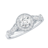 Round cut moissanite antique engagement ring by Rosec Jewels with intricate vintage detailing and a polished gold band.