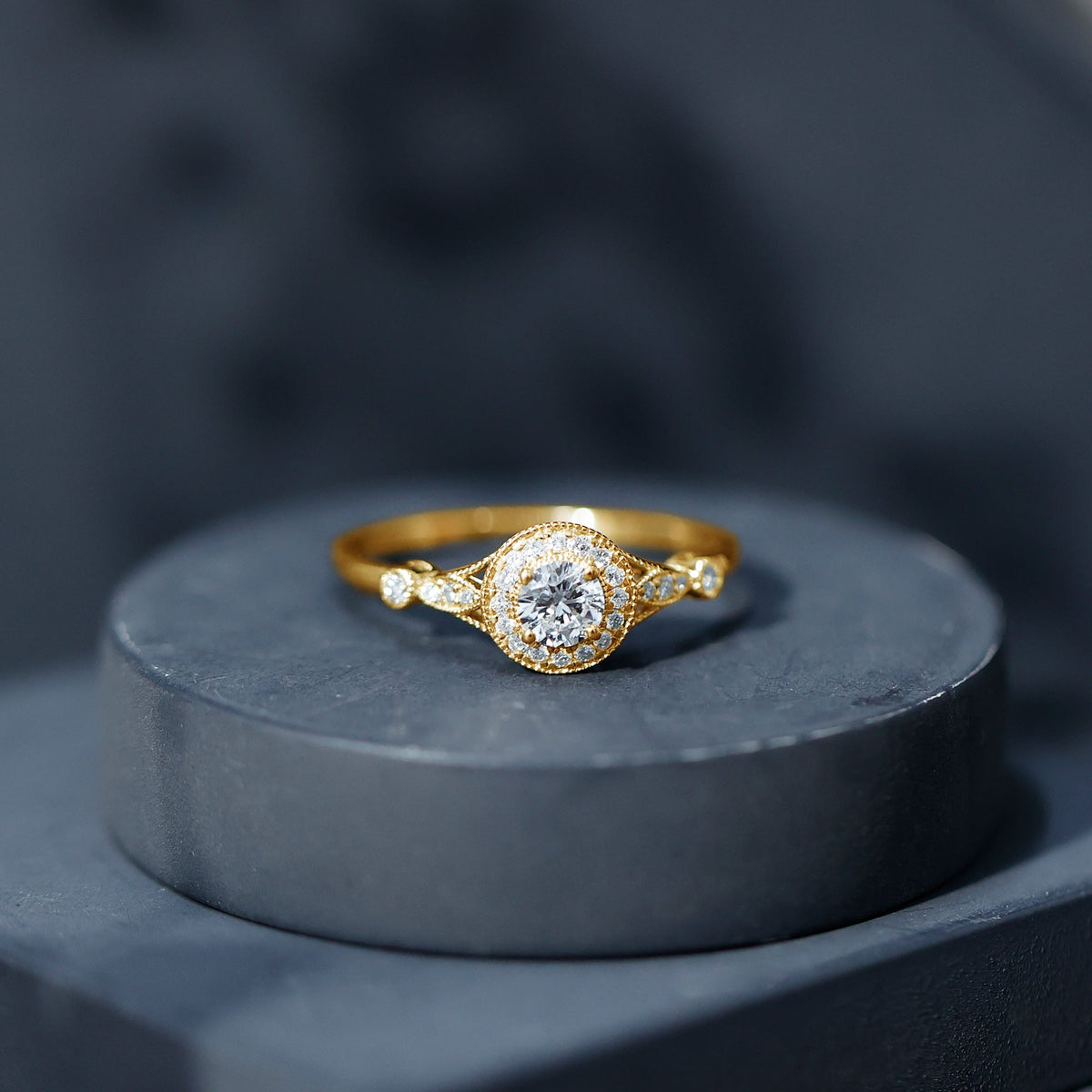Round cut moissanite antique engagement ring by Rosec Jewels featuring intricate detailing and a vintage-inspired design.
