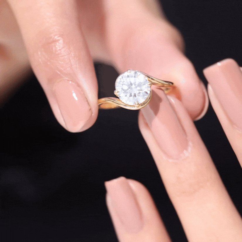 Round cut 2 carat moissanite solitaire engagement ring with bypass shank by Rosec Jewels, showcasing a sparkling yellow gemstone.