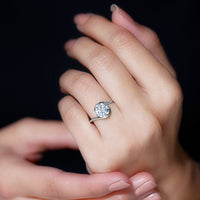 Round cut 2 carat moissanite solitaire engagement ring with bypass shank by Rosec Jewels, showcasing the elegant design.