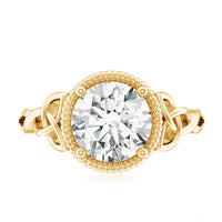 Brilliant cut moissanite engagement ring with rope frame from Rosec Jewels, showcasing a sparkling center stone and intricate band detail.