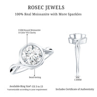 Certified moissanite engagement ring with bezel setting and crossover shank, featuring elegant craftsmanship and sparkling stone details.