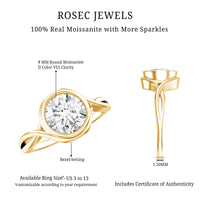 Certified Moissanite bezel set engagement ring with crossover shank, featuring a sparkling central stone and elegant band design.