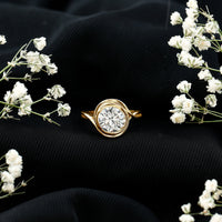 Certified moissanite bezel set engagement ring with a crossover shank by Rosec Jewels, showcasing a central sparkling stone and elegant design.