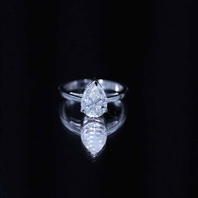 Yellow gold 2 carat moissanite pear-shaped engagement ring for women by Rosec Jewels, featuring a sparkling gemstone and elegant design.