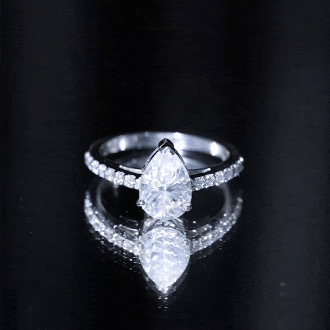 Yellow gold certified moissanite teardrop engagement ring with intricate band design by Rosec Jewels.