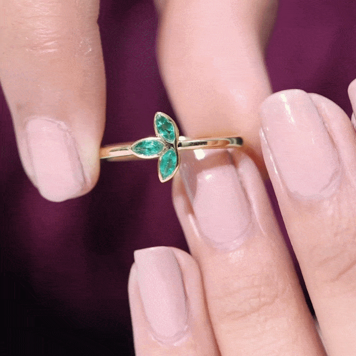 Marquise cut emerald leaf promise ring in bezel setting by Rosec Jewels, featuring detailed leaf design and yellow gold finish.