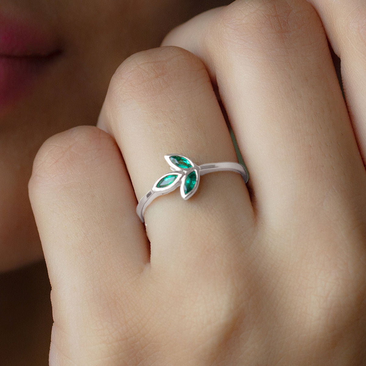 Marquise cut emerald leaf promise ring in bezel setting by Rosec Jewels, showcasing a detailed green emerald design.