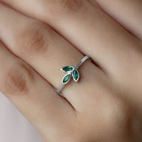 Marquise cut emerald leaf promise ring in bezel setting by Rosec Jewels, showcasing a detailed green gemstone design.