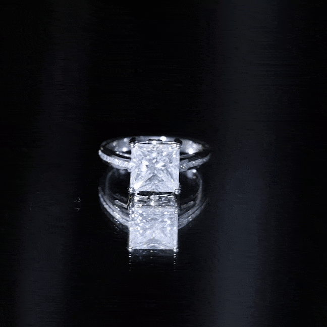 Yellow gold solitaire moissanite princess cut engagement ring with side stones from Rosec Jewels.