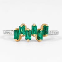 Rosec Jewels emerald promise ring with baguette cut emerald center and diamond side stones on a silver band.