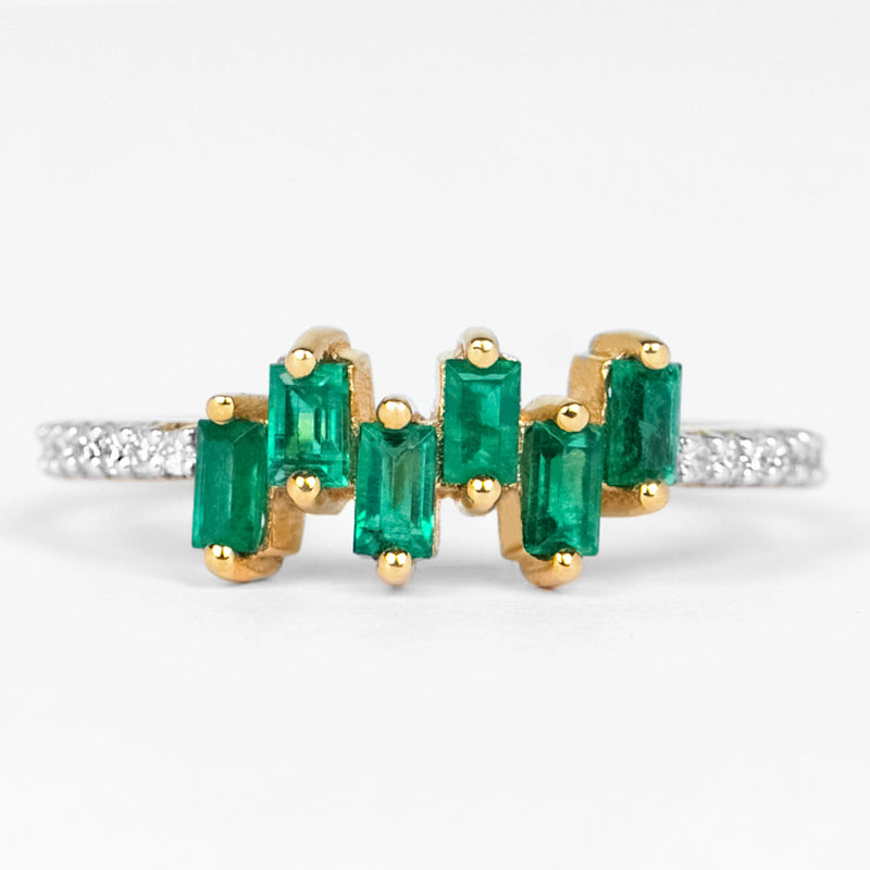 Rosec Jewels emerald promise ring with baguette cut emerald center and diamond side stones on a silver band.