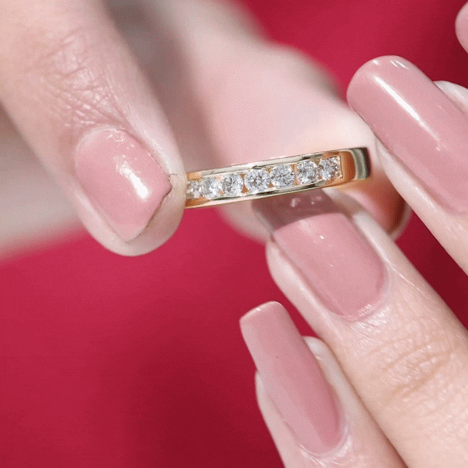 Yellow gold diamond seven stone channel set band ring by Rosec Jewels, featuring sparkling diamonds in a sleek, elegant design.