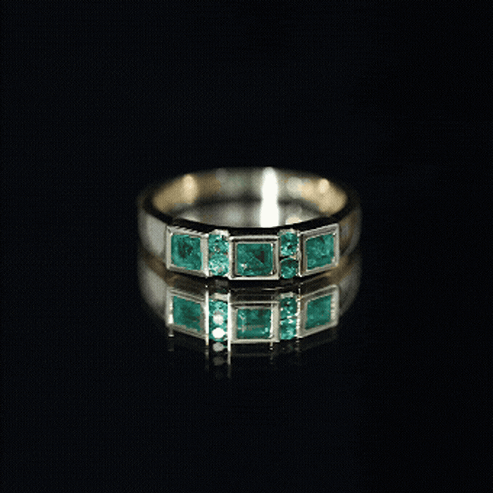 Natural emerald princess cut band ring by Rosec Jewels, featuring a sleek yellow gold setting with a central emerald gemstone.