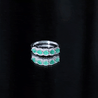 Pear-shaped emerald wedding ring with diamond accents from Rosec Jewels, featuring a silver band and intricate detailing.