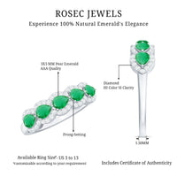 Pear-shaped emerald anniversary wedding ring by Rosec Jewels with diamond accents, featuring a detailed close-up of the ring's design.