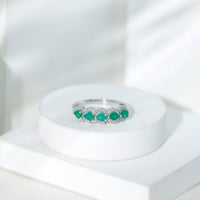 Pear-shaped emerald anniversary wedding ring with diamond accents from Rosec Jewels, showcasing a sparkling green gemstone and elegant design.