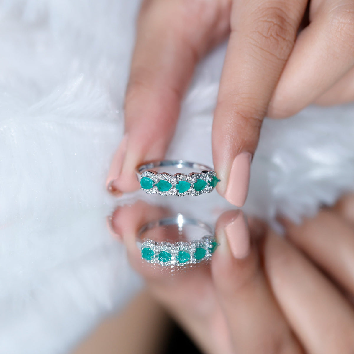 Pear-shaped emerald anniversary wedding ring with diamond accents by Rosec Jewels, featuring a detailed close-up of the ring design.