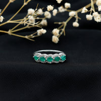 Pear-shaped emerald anniversary wedding ring with diamond accents from Rosec Jewels, featuring a elegant and sparkling design.