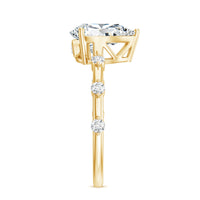 Pear Shaped Moissanite Engagement Ring with Spaced Accent
