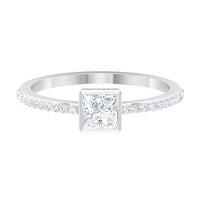 Rosec Jewels 3/4 CT cubic zirconia bezel set solitaire ring with side stones, showcasing a sparkling center stone and detailed band design.