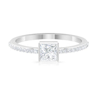 Rosec Jewels cubic zirconia solitaire ring with 3/4 carat bezel setting and side stones, showcasing elegant jewelry design.