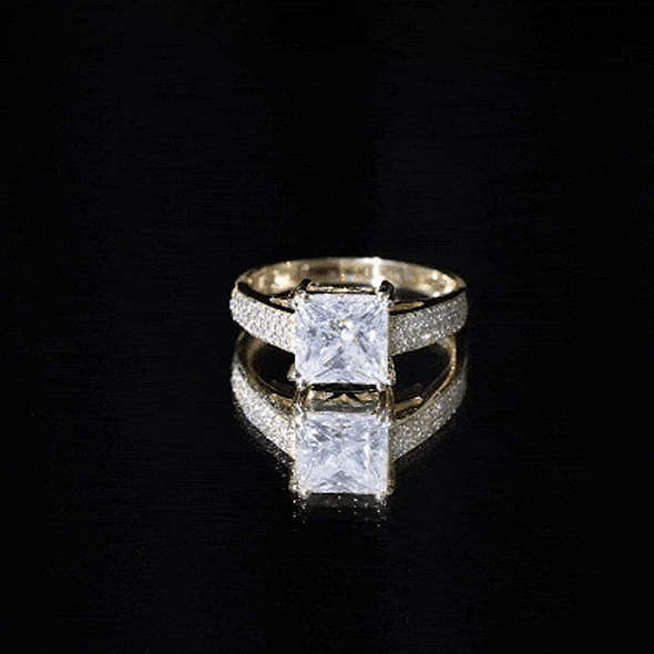 Yellow gold princess cut moissanite engagement ring from Rosec Jewels with certificate, featuring a sparkling center stone and elegant band.