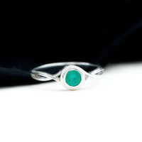 Round Cut Emerald Solitaire Ring with Crossover Band