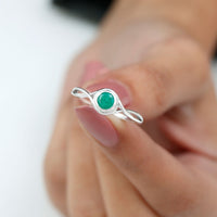 Round Cut Emerald Solitaire Ring with Crossover Band