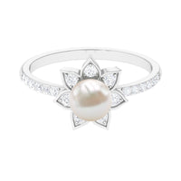 Freshwater pearl solitaire floral engagement ring with diamond from Rosec Jewels, featuring a delicate pearl and sparkling diamond setting.
