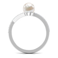 Cultured 2-carat white pearl engagement ring with diamond bypass shank from Rosec Jewels, showcasing elegant design and sparkling diamonds.