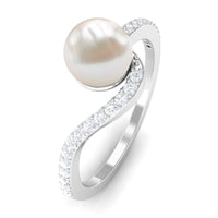 Cultured 2 Carat White Pearl Engagement Ring with diamond bypass shank, featuring elegant rose gold band and intricate design.