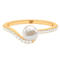 Cultured 2 Carat white pearl engagement ring with diamond bypass shank by Rosec Jewels, featuring a stunning pearl centerpiece and sparkling diamonds.
