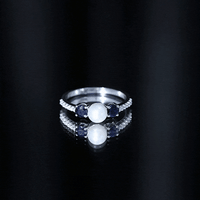 Natural freshwater pearl, blue sapphire, and diamond 3-stone engagement ring by Rosec Jewels, showcasing elegant gemstones and gold setting.