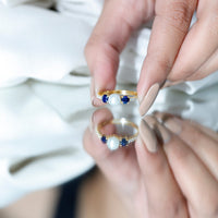 Natural freshwater pearl and blue sapphire 3-stone engagement ring with diamond accents by Rosec Jewels.