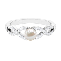 Rosec Jewels 2 Carat freshwater pearl crossover engagement ring with diamond accents, showcasing elegant pearl and sparkling stones.