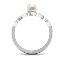 Two-carat freshwater pearl crossover engagement ring with diamonds by Rosec Jewels, featuring elegant white pearls and sparkling accents.