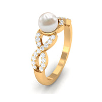 Freshwater pearl crossover engagement ring with diamond accents by Rosec Jewels, showcasing elegant design and sparkling details.