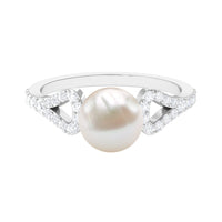 Rosec Jewels cultured 7.4 carat freshwater pearl solitaire engagement ring with a diamond, showcasing a elegant and classic design.