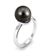 Tahitian pearl solitaire engagement ring with diamond halo by Rosec Jewels, featuring a lustrous black pearl and sparkling diamond accents.