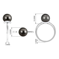 Tahitian pearl solitaire engagement ring with diamond halo by Rosec Jewels, featuring a central dark pearl and surrounding sparkling diamonds.