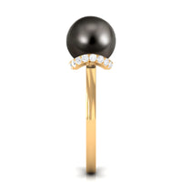 Tahitian pearl solitaire engagement ring with diamond halo by Rosec Jewels, showcasing the elegant pearl and sparkling surrounding diamonds.